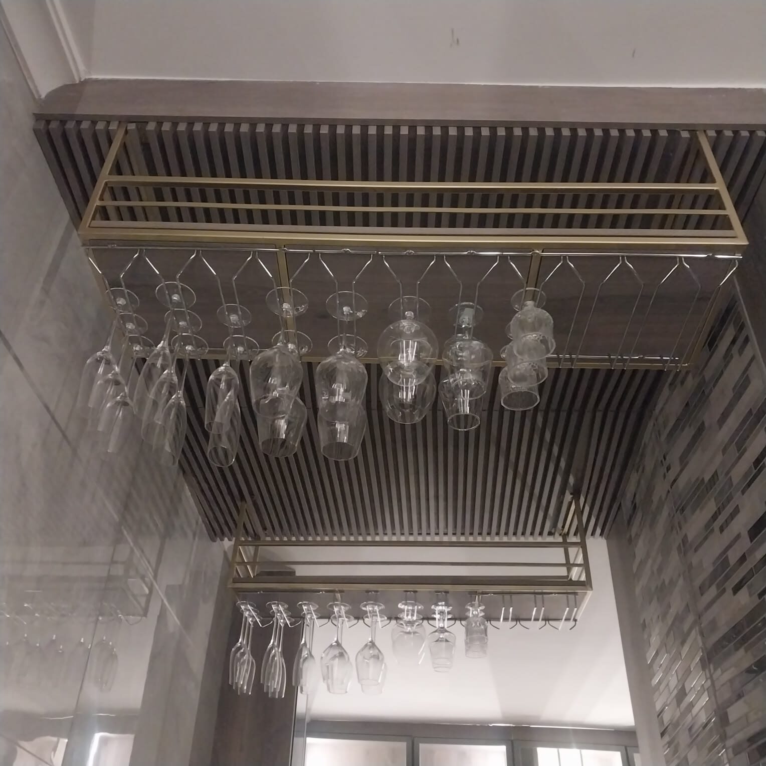 Custom brass stemware rack — close-up of Vukea craftsmanship
