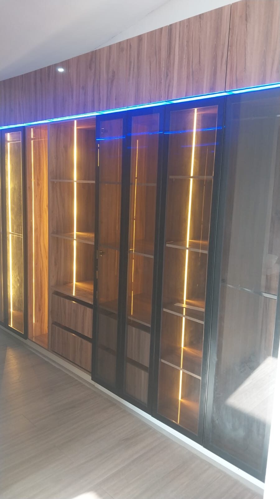 LED-lit wooden display cabinet with glass doors