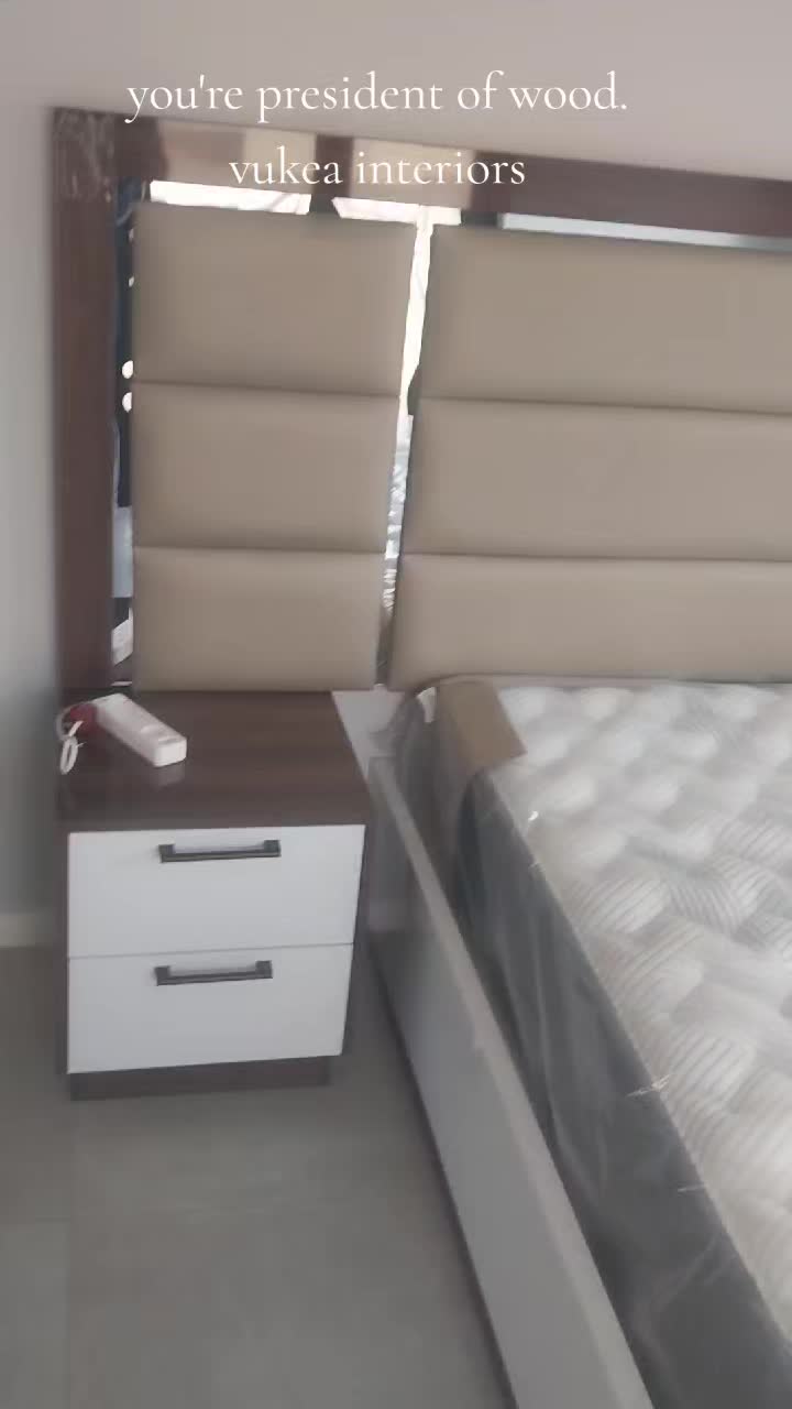 Fluted headboard against dark wood cabinetry