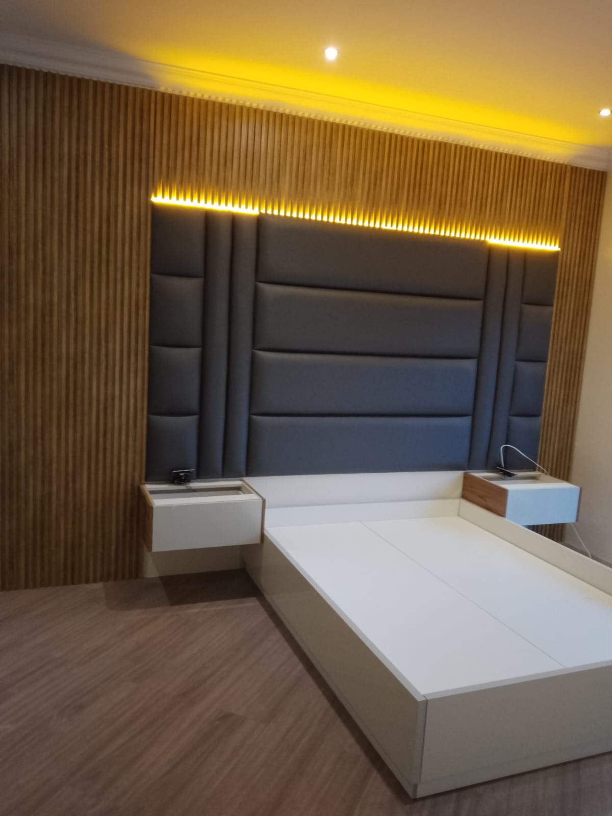 Fluted headboard with LED strip, side view