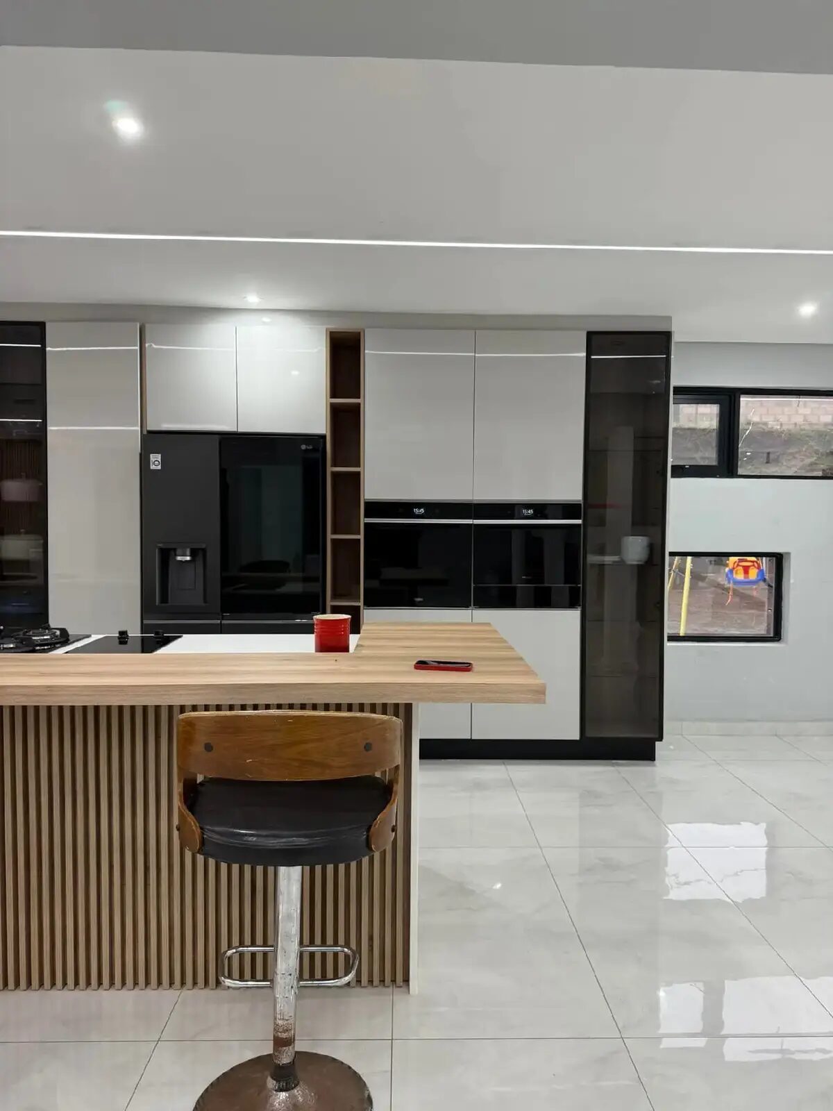 Modern kitchen with fluted-wood island