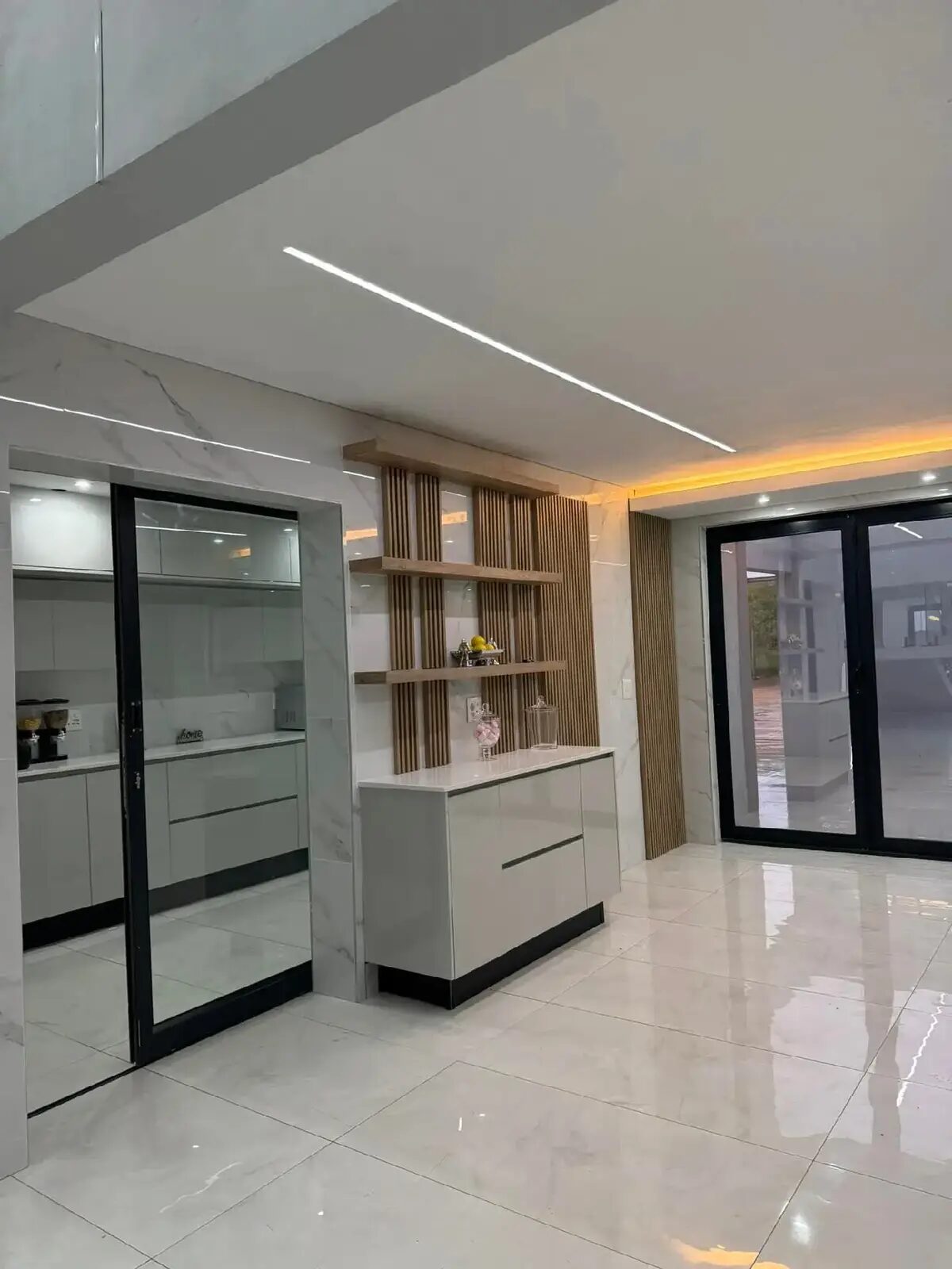 Built-in room-divider cabinet near sliding doors